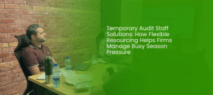 Audit professionals reviewing financial statements and working papers as part of temporary audit staff solutions.